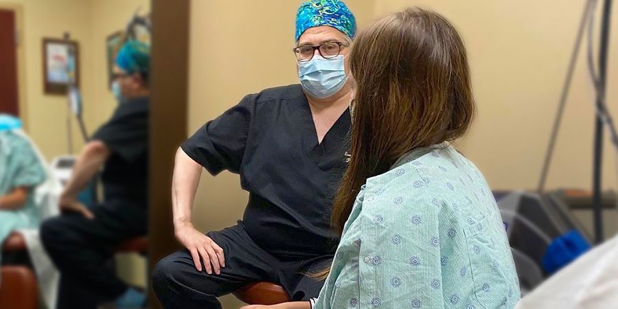 Dr. Sorokin sits with patient in consultation